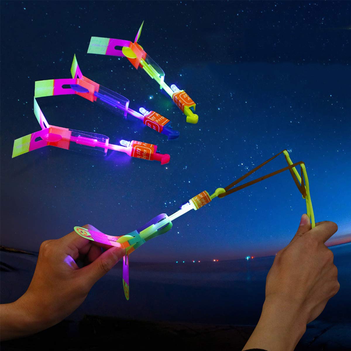 Rocket Slingshot Flying with LED Lights Glow The Dark Party,12 Launchers + 12 LED Helicopters,Slingshot Amazing Arrow Helicopter Glow Supplies for Kids (24 Pieces)