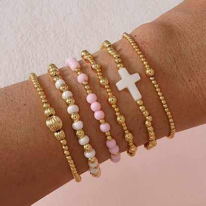 SHINUS BOHO Cross Gold Beaded Bracelet Stack for Women,Bohemian Stretch White Pink Beads Stackable Bracelets Set Fashion Prom Party Accessories Jewelry Gift Friendship