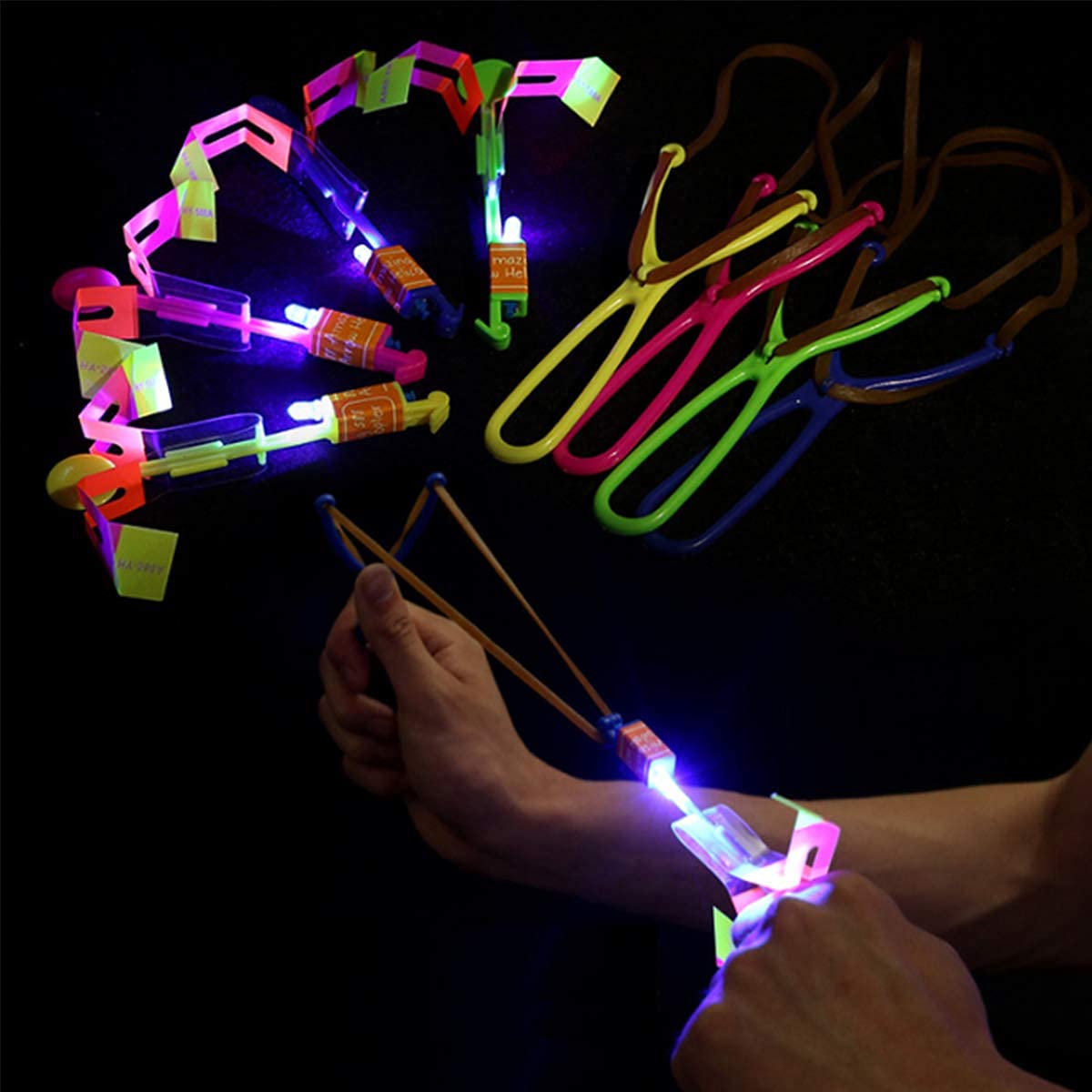 Rocket Slingshot Flying with LED Lights Glow The Dark Party,12 Launchers + 12 LED Helicopters,Slingshot Amazing Arrow Helicopter Glow Supplies for Kids (24 Pieces)