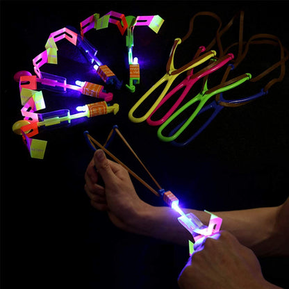 Rocket Slingshot Flying with LED Lights Glow The Dark Party,12 Launchers + 12 LED Helicopters,Slingshot Amazing Arrow Helicopter Glow Supplies for Kids (24 Pieces)