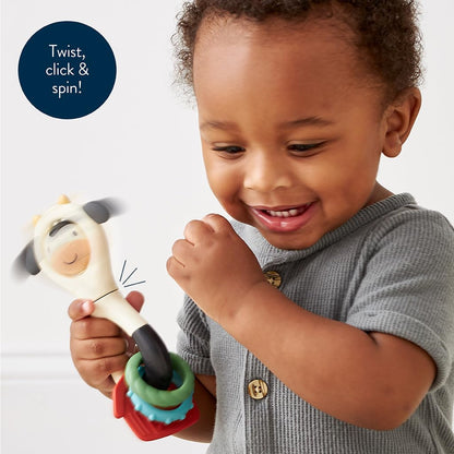 Itzy Ritzy Spinner Rattle Toy – Cow Design Sensory Teething Rattle Includes Spinning Face, Clicks, Rattles & Textured Teethers – Designed for Ages 3 Months and Up (Cow)