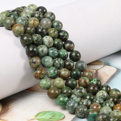 NITOPUPU 100Pcs 10mm Natural Smooth African Turquoise Gemstone Beads Round Loose Stone Beads for Jewerly Making with Crystal Stretch Cord