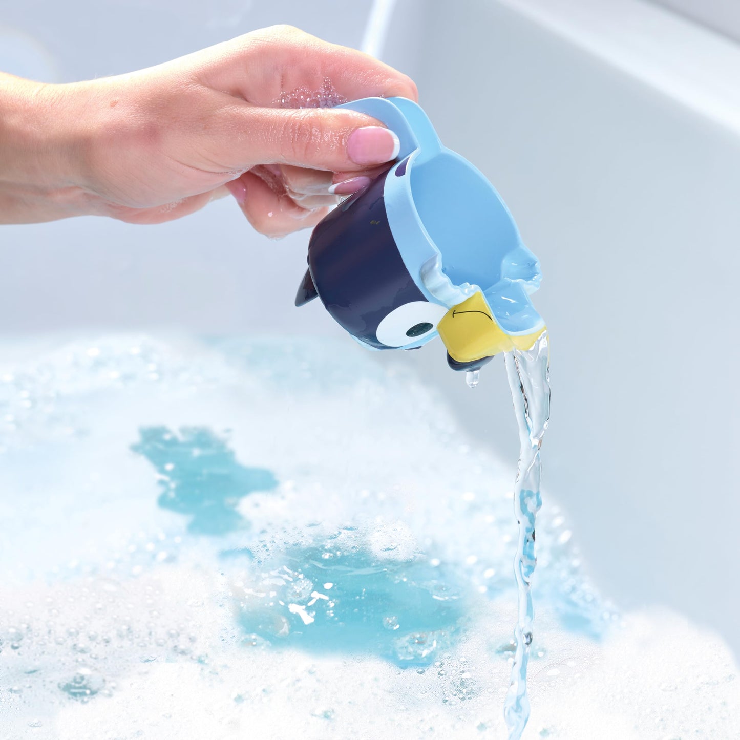 TOMY Toomies Bluey Bath Toys - Bluey's Family Pourers - Includes Chilli, Bandit, Bingo and Bluey Figures - Nesting and Stacking Cups for Bath, Beach or Pool - 4 Count - Ages 18 Months and Up
