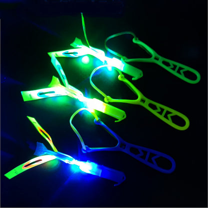 TOYARA Amazing Led Flying Toys for Toddler -12 PCS Light up Slingshot LED Helicopter Toy - Arrow Planes Glow in The Dark Party Favors for Kids Summer Toys Outdoor Game Birthday Gifts for Kid 8-12