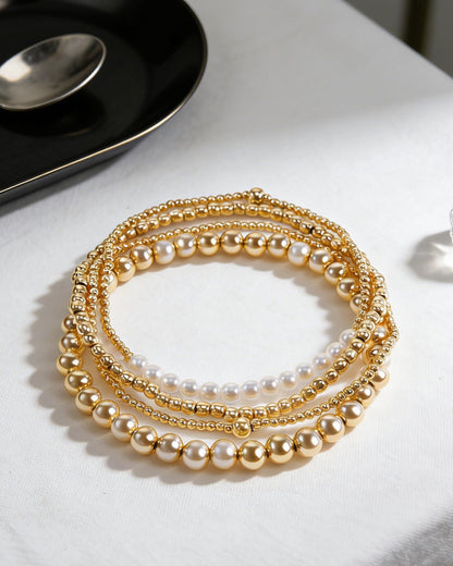 CLOORDE 4 Pcs Gold Beaded Bracelets for Women Layered 14k Gold Plated Beads Bracelets Trendy Stretch Stack Pearl Golden Beaded Brace-lets Wedding Party Prom Hand Jewelry Accessories Gifts for Her