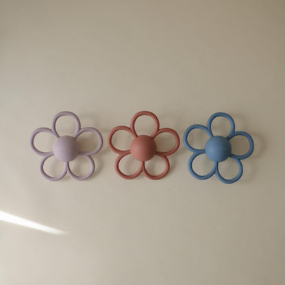 mushie Silicone Baby Daisy Rattle Teether Toy (Soft Lilac)
