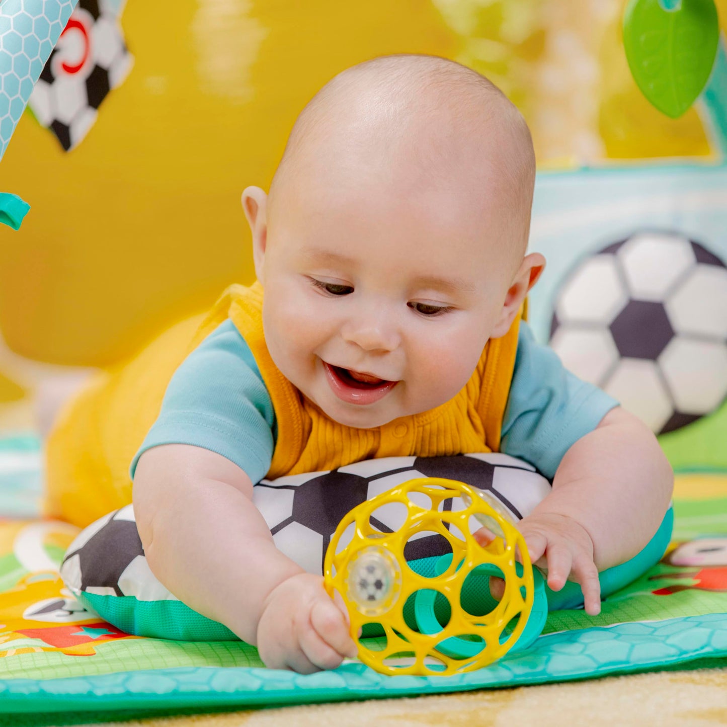Bright Starts Grip & Kick Oball Activity Gym, Soccer Theme with Easy-Grasp Baby Toys, Baby Play Gym, Kick Pad with Activated Lights & Tummy Time Pillow, Unisex, Newborn+