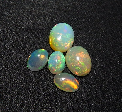 Myhealingworld Natural Ethiopian Opal 4x6mm 6x8mm oval cabochon AAA quality loose calibrated gemstones for jewelry making oval 4x6mm = 3 pcs 6x8mm = 2 pcs